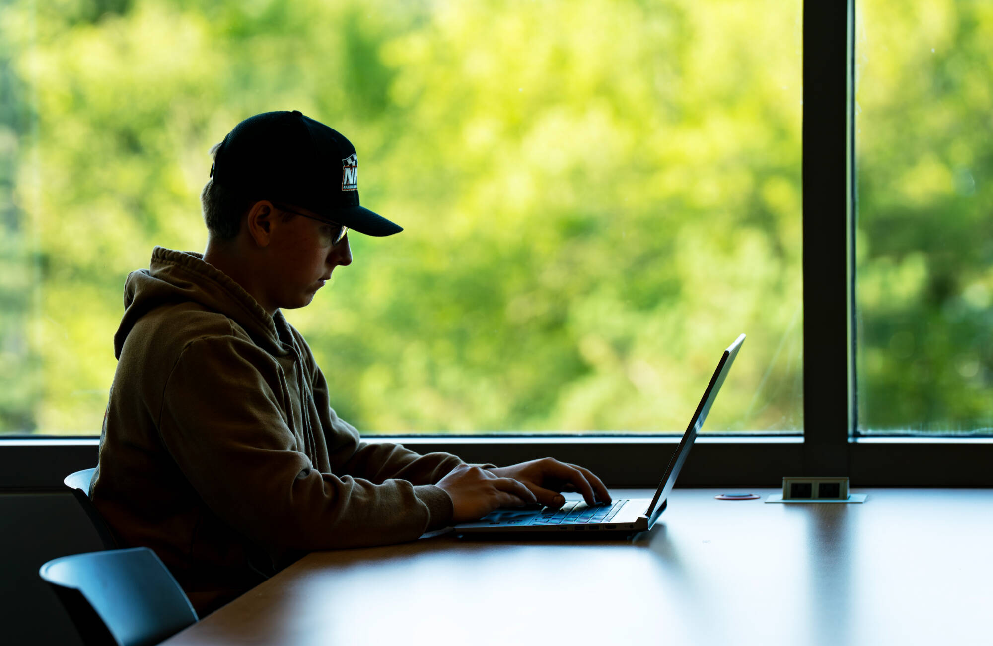 Nathan Koester works inside the Mary Idema Pew Library on the first day of classes on August 22.